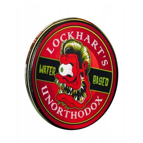 Czarna, zaokrąglona puszka z kolorową grafiką z przodu przedstawiającą przerażającą maskotkę. Widoczne napisy LOCKHART'S oraz UNORTHODOX. Puszka jest zamknięta, prezentowana z przodu, na białym tle.