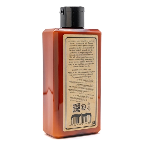 Odżywka do włosów 250 ml w bursztynowej, przezroczystej butelce z czarną zakrętką. Beżowa etykieta z opisem składu i użycia. Produkt stoi tyłem na białym tle, pokazując detale etykiety.