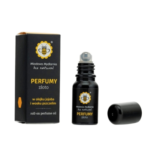 Perfumy roll-on Złoto 10 ml w czarnej butelce z zakrętką, umieszczone obok opakowania z grafiką pszczoły. Butelka wykończona szklanym aplikatorem, na etykiecie widoczne napisy „PERFUMY” i „złoto”. Produkt na jednolitym tle.
