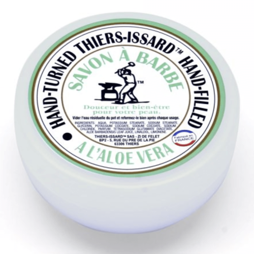 Mydło do golenia Aloe Vera 150g w białym, okrągłym pojemniku z kolorowym nadrukiem i czarnym logo SAVON À BARBE na froncie. Nowe, nieotwierane, z jednolitym tłem podkreślającym etykietę.