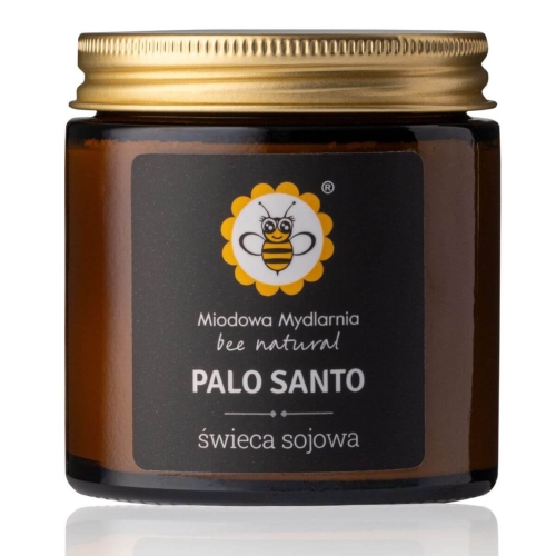 Świeca sojowa Palo Santo w szklanym słoiku o miedzianym kolorze. Nakrętka w kolorze złotym, etykieta z czytelnym logo pszczoły oraz napisami w jasnych kolorach. Produkt widoczny z boku, stojący na gładkim tle.