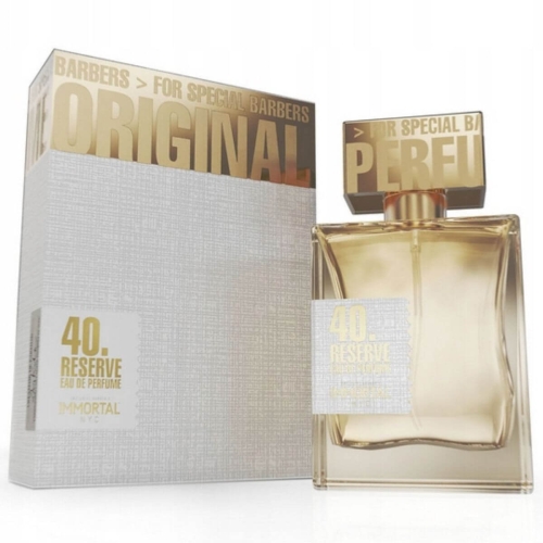 Woda perfumowana unisex w przezroczystym flakonie z kwadratową złotą nakrętką, obok szarego opakowania z złotymi napisami „ORIGINAL” i „40. RESERVE Eau De Perfume” na białym, minimalistycznym tle.
