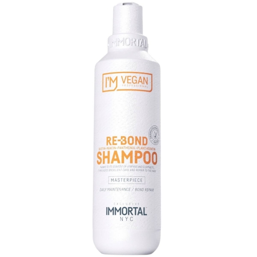 Biała butelka szamponu Re-Bond 250 ml z logo I'M VEGAN i napisem SHAMPOO. Etykieta pokazuje składniki: biotynę i panthenol. Produkt stoi na jednolitym tle, podkreślając minimalistyczny design.