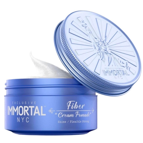 Niebieska pomada Fiber Cream 150 ml z logo IMMORTAL, otwarta pokrywka odsłania białą kremową konsystencję na jednolitym tle, podkreślając detale opakowania.