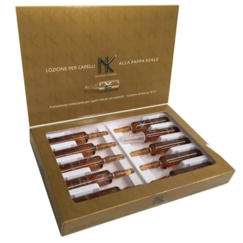 Ampułki do włosów z mleczkiem pszczelim w złotym opakowaniu zawierające 10 sztuk po 10 ml. Widok z góry, produkt leży otwarty w białej wkładce. Widoczne etykiety z nazwą oraz wskazaniami użycia.