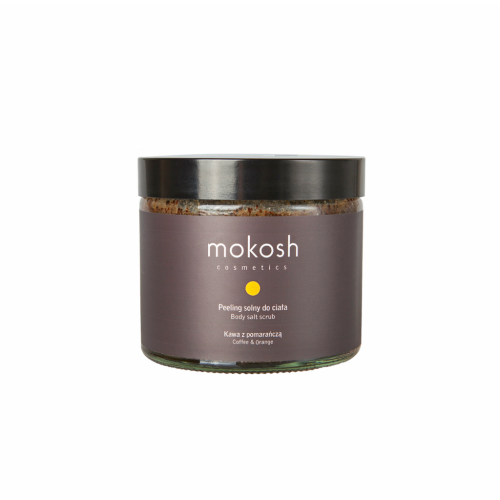 Szklany słoik peelingu solnego Mokosh, z czarną zakrętką. Etykieta: Peeling solny do ciała, Kawa z pomarańczą, ujęcie frontalne, słoik leży poziomo na białym tle.